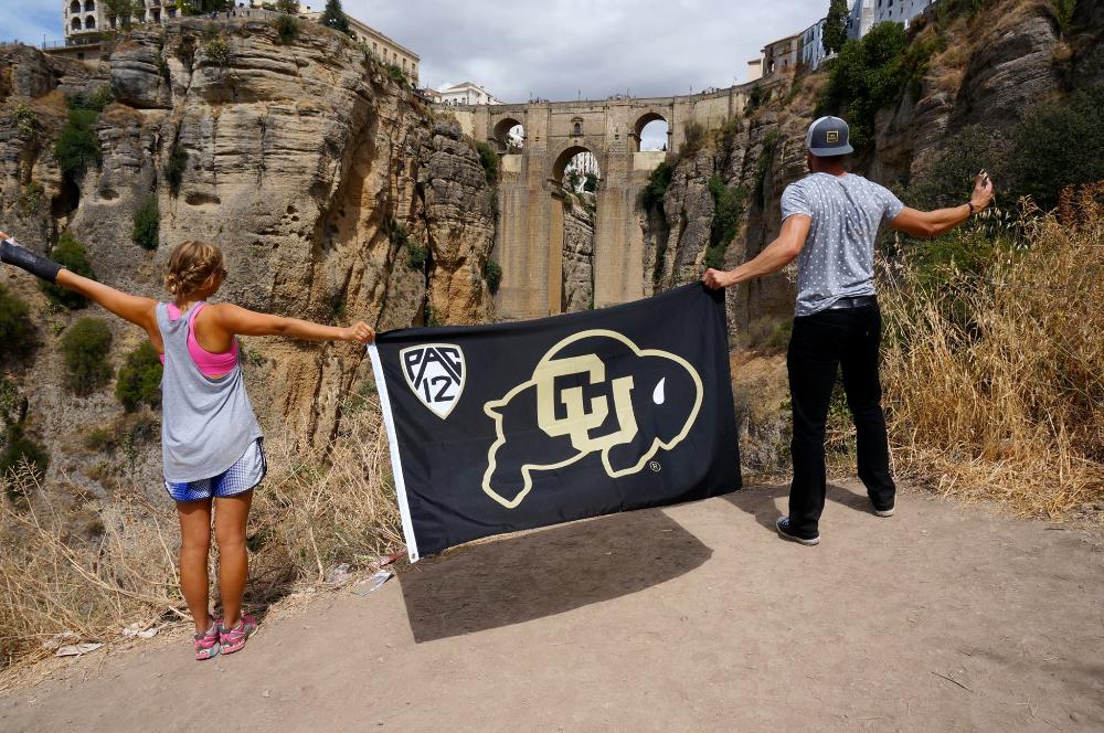 Students holding up CU flag in Spain