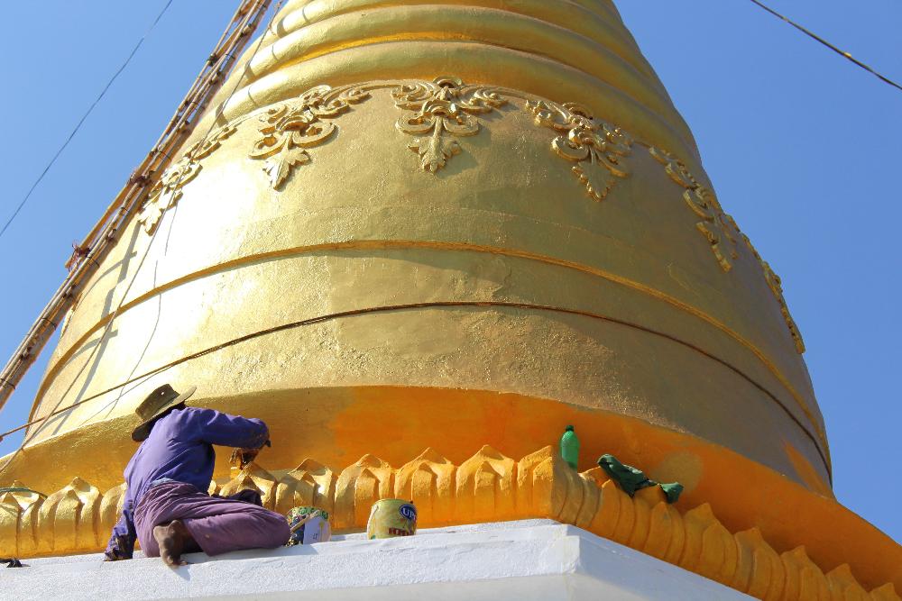 Gold pagoda in Myanmar being repainted