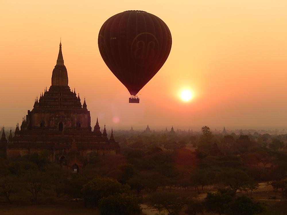 Hot air balloon over Myanmar temple by Nik Treece
