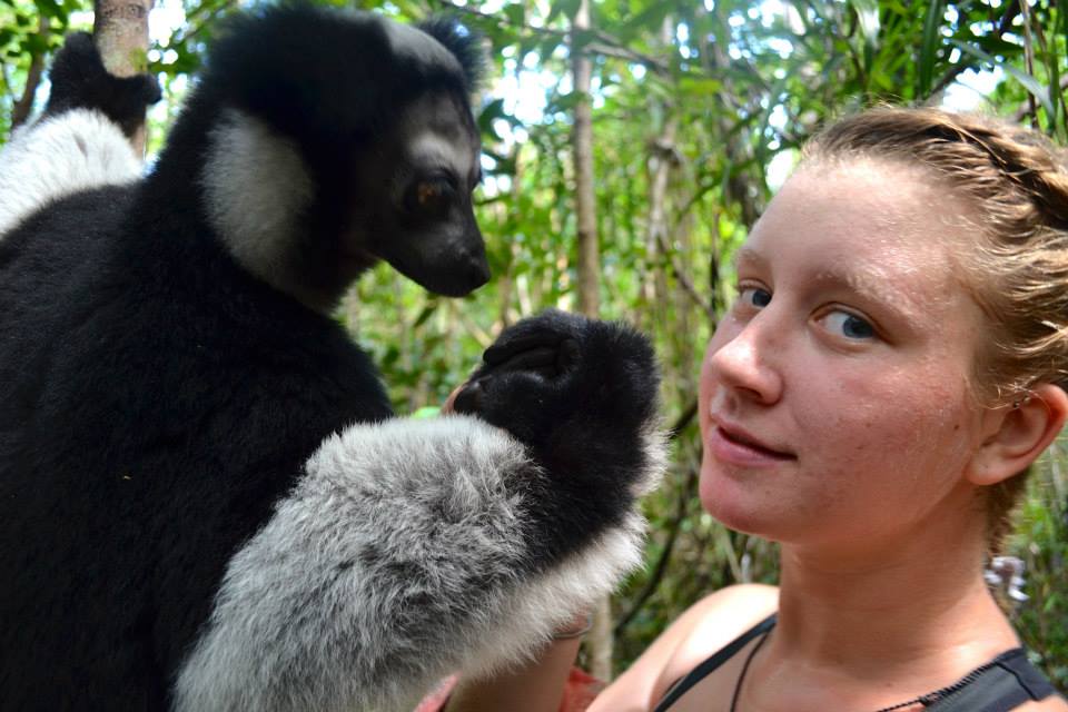 Student with lemur in Madagascar by Alison Shlom