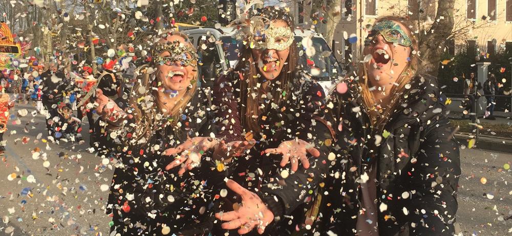 Students throwing confetti in Venice, Italy by Kathryn Balsley
