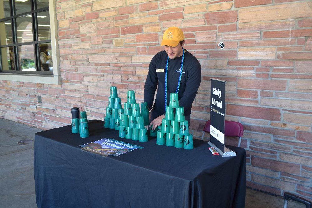 Marketing and Outreach Intern Andrew shows off his cup stacking skills