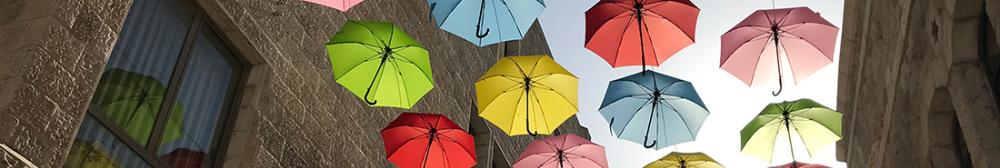 Colorful umbrellas hanging above an alley in Israel