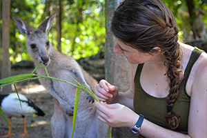 student feeding kangaroo