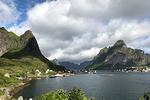 Norwegian town on a lake with dramatic mountains