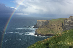 Irish cliffs and sea with a rainbow