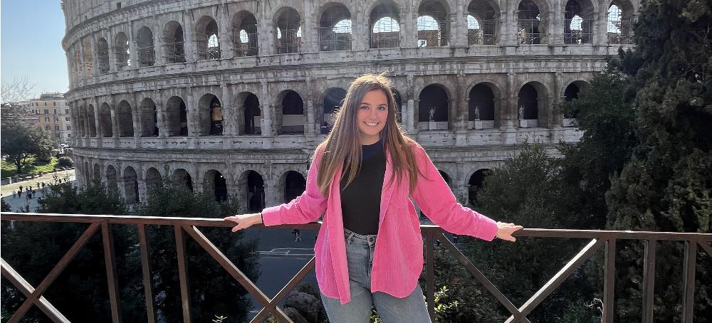 Student in front of Colosseum in Rome, Italy