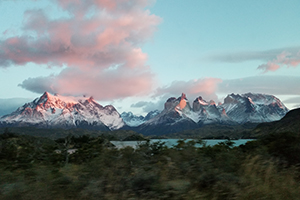 Snow-topped Patagonian mountains with clouds pink in the sunset