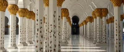 Walkway with ornate columns in Egypt, by Jordan Witt